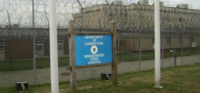 Disability Law Center Finds Unlawful, Violent Practices and Unsafe Environmental Conditions Persist at Bridgewater State Hospital Exterior view of Bridgewater State Hospital, with the sign and exterior razor wire fence in front.